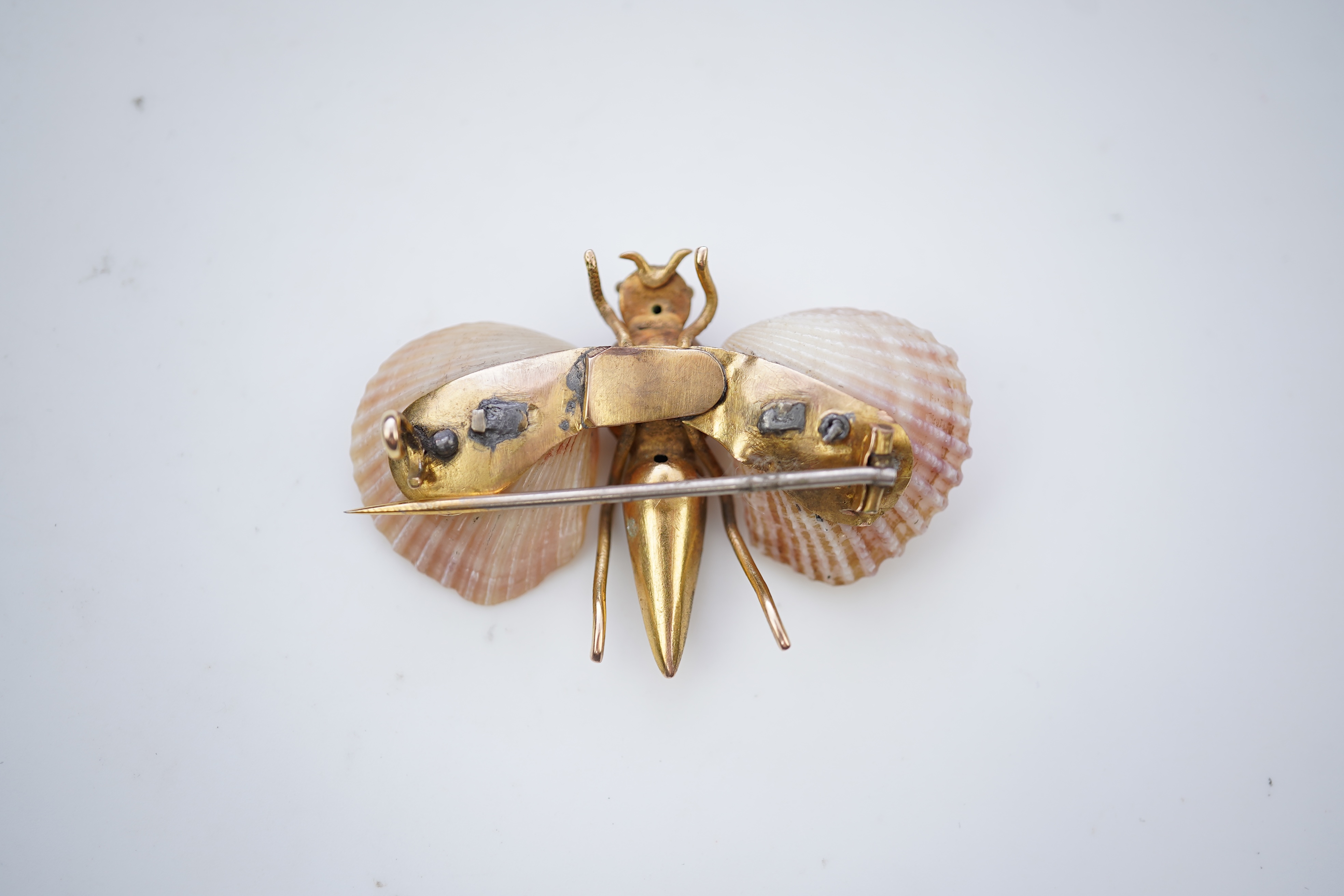 A gold and shell brooch, late 19th century composite